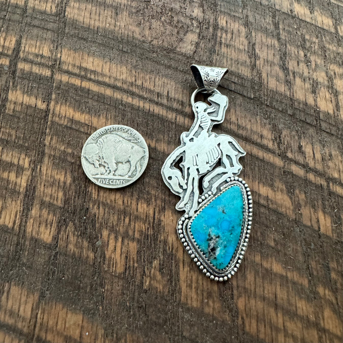 The Turquoise Skeleton Bronc Pendant
