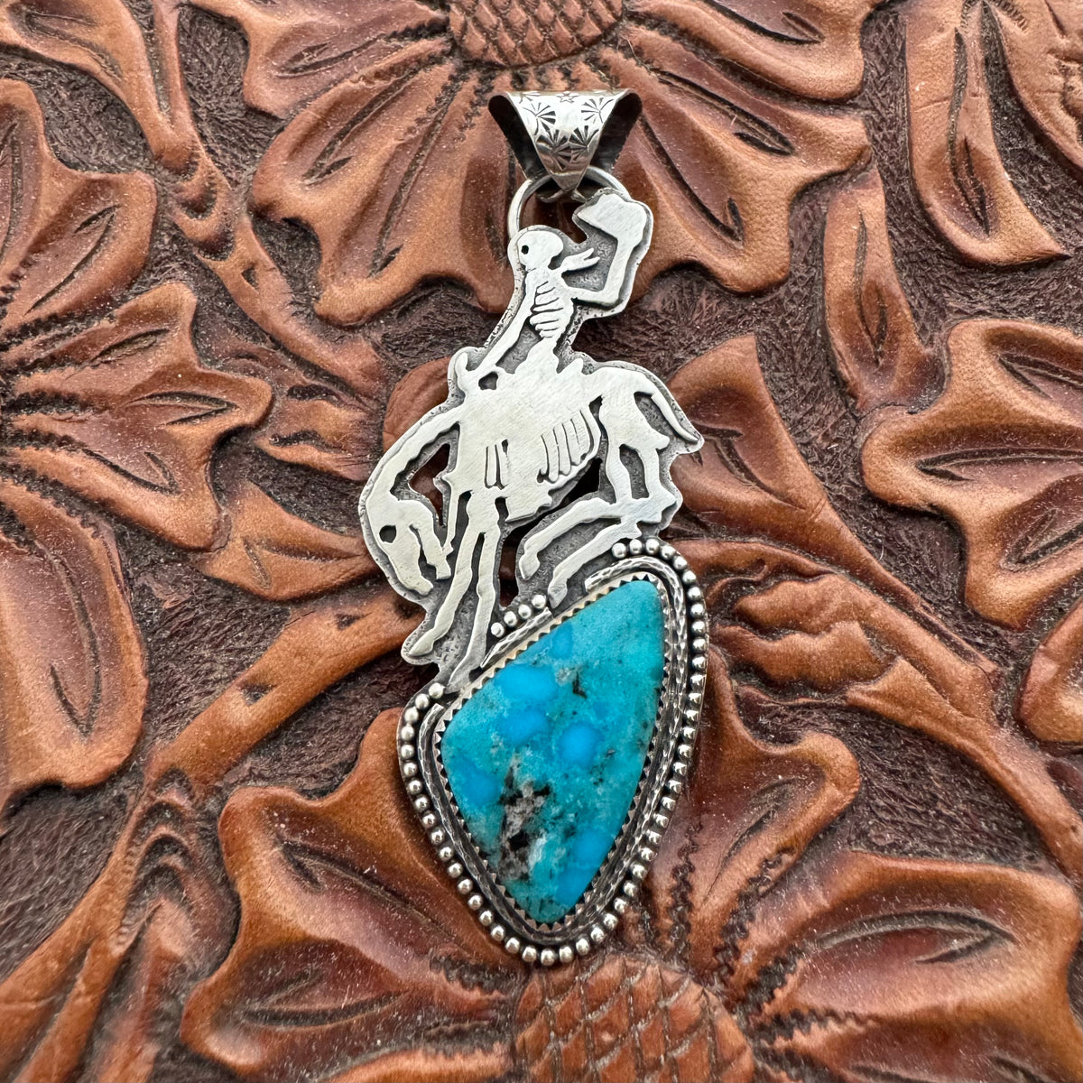 The Turquoise Skeleton Bronc Pendant
