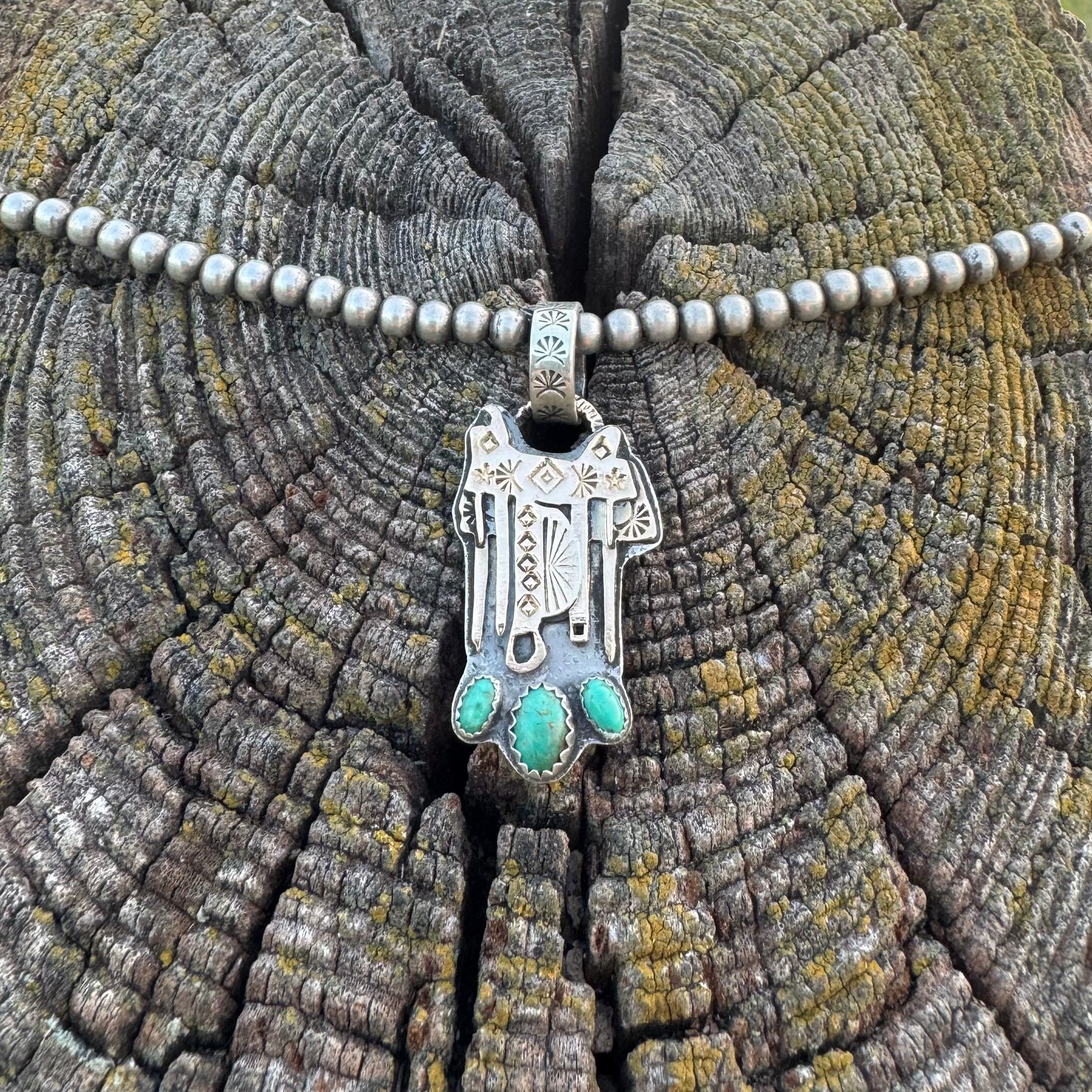 The Golden Saddle Pendant