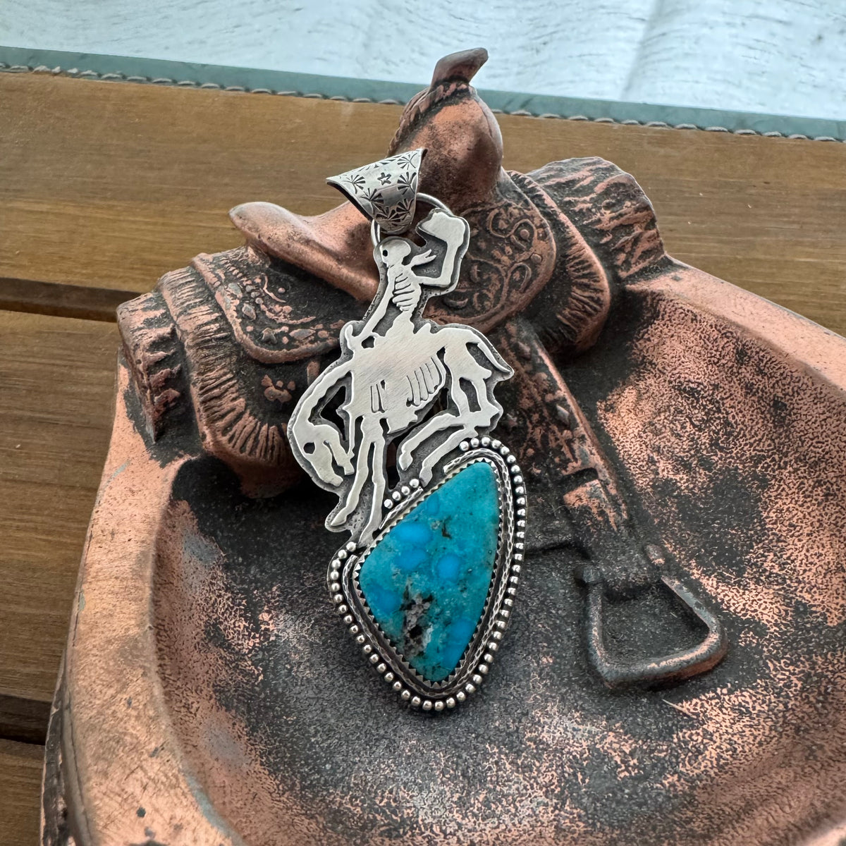 The Turquoise Skeleton Bronc Pendant