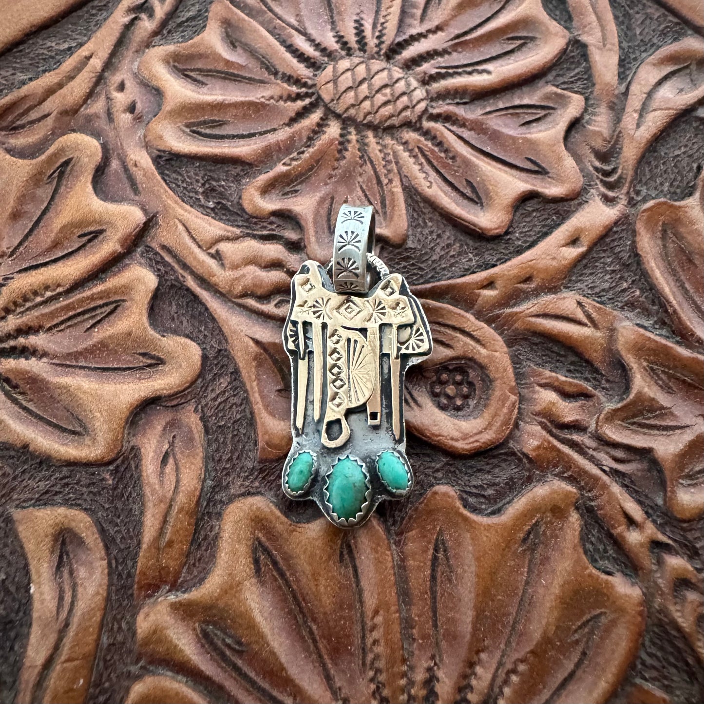 The Golden Saddle Pendant