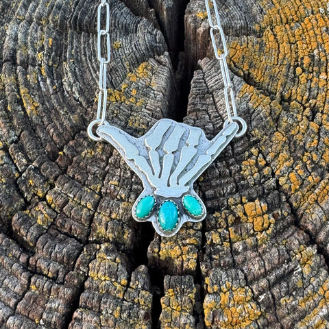 Skelly Hand Necklace (medium with mid-blue)